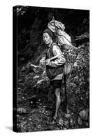 Black and white picture of a Sherpa carrying meat up to Everest Base Camp in Nepal-David Chang-Stretched Canvas