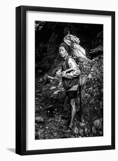 Black and white picture of a Sherpa carrying meat up to Everest Base Camp in Nepal-David Chang-Framed Photographic Print