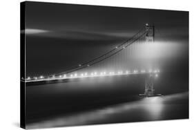 Black And White View Of The Golden Gate Bridge At Night With Silky Low Fog Around The Tower-Joe Azure-Stretched Canvas