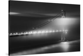 Black And White View Of The Golden Gate Bridge At Night With Silky Low Fog Around The Tower-Joe Azure-Stretched Canvas