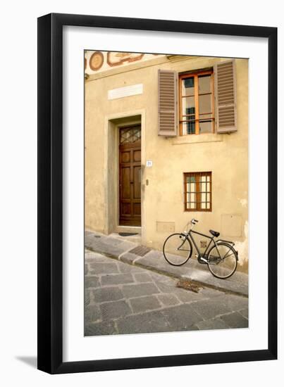 Black Bicycle by the Yellow Wall, Florence-Igor Maloratsky-Framed Art Print