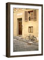 Black Bicycle by the Yellow Wall, Florence-Igor Maloratsky-Framed Art Print