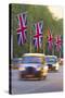 Black Cabs Along the Mall with Union Jack Flags, London, England, United Kingdom, Europe-Stuart Black-Stretched Canvas