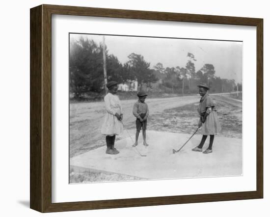 Black Children Playing Golf Photograph-Lantern Press-Framed Art Print