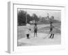 Black Children Playing Golf Photograph-Lantern Press-Framed Art Print