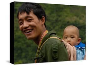 Black Lisu Carrying Baby at Market near Fugong, Nujiang Prefecture, Yunnan Province, China-Pete Oxford-Stretched Canvas