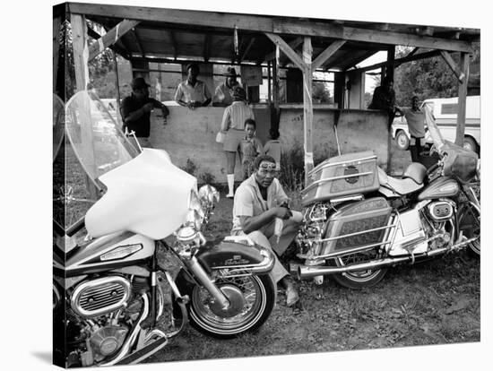 Black Motorcyclist of the Big Circle Motorcycle Association Sitting Between Harley Davidson Bikes-John Shearer-Stretched Canvas