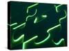 Black Puzzle with Green Light Shining Through the Cracks-null-Stretched Canvas