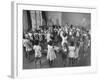 Black Teacher Leading Children in Dancing to Nursery Rhymes in Class at the National War Memorial-null-Framed Photographic Print