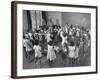 Black Teacher Leading Children in Dancing to Nursery Rhymes in Class at the National War Memorial-null-Framed Photographic Print