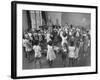 Black Teacher Leading Children in Dancing to Nursery Rhymes in Class at the National War Memorial-null-Framed Photographic Print