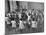 Black Teacher Leading Children in Dancing to Nursery Rhymes in Class at the National War Memorial-null-Mounted Photographic Print