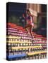 Black Woman Running Up Stairs-null-Stretched Canvas