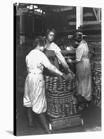 Black Women Laborers Weighing Wire Coils and Recording Weights to Establish Wage Rates, in Factory-F^p^ Burke-Stretched Canvas