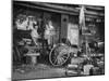 Blacksmith Working in His Shop-John Phillips-Mounted Photographic Print