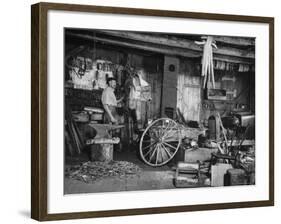 Blacksmith Working in His Shop-John Phillips-Framed Photographic Print