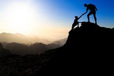 Man and Woman Help Silhouette in Mountains-blas-Photographic Print