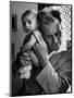 Blind Doctor Albert A. Nast Holding Ear to Back of 3 Month Old Instead of Using a Stethoscope-Thomas D. Mcavoy-Mounted Premium Photographic Print