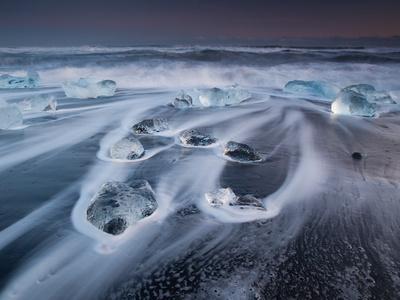 https://imgc.allpostersimages.com/img/posters/blocks-of-ice-on-the-black-sand-beach-in-southern-iceland_u-L-Q12X4KN0.jpg?artPerspective=n