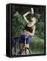 Blond Bicyclist Cooling Off with Bottled Water-null-Framed Stretched Canvas