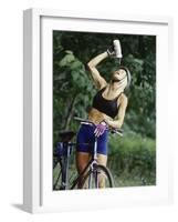 Blond Bicyclist Cooling Off with Bottled Water-null-Framed Photographic Print