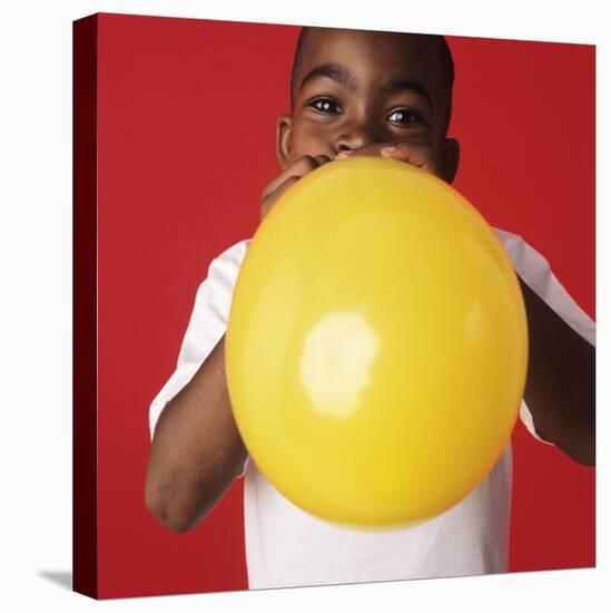 Blowing Up a Balloon-Ian Boddy-Stretched Canvas