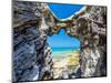 Blue and turquoise Sargasso Sea, glimpsed through an arch in the island's distinctive rocks-Barry Davis-Mounted Photographic Print