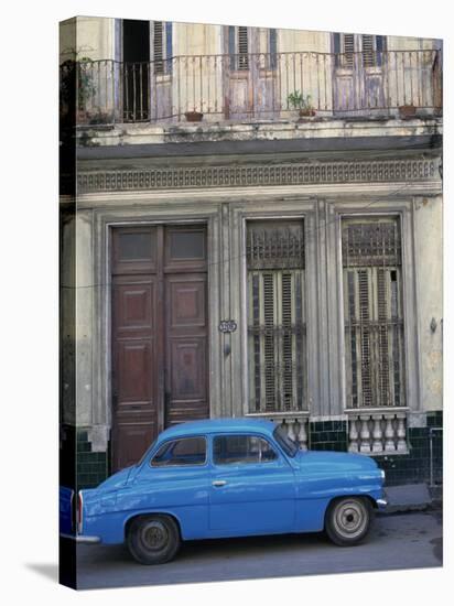Blue Car Parked Outside a Shabby House in Old Havana, Cuba, West Indies, Central America-Mawson Mark-Stretched Canvas