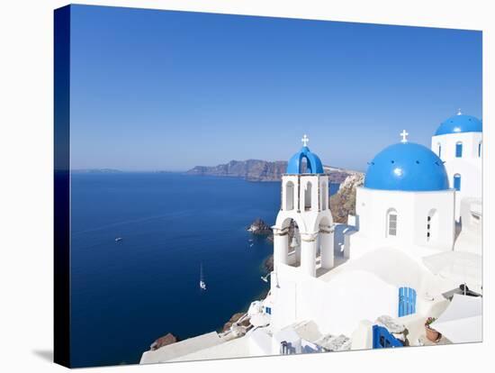 Blue Domed Churches in the Village of Oia, Santorini (Thira), Cyclades Islands, Aegean Sea, Greece-Gavin Hellier-Stretched Canvas