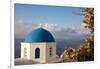 Blue domed Greek Orthodox church with bougainvillea flowers in Oia, Santorini, Greece.-Michele Niles-Framed Photographic Print