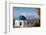 Blue domed Greek Orthodox church with bougainvillea flowers in Oia, Santorini, Greece.-Michele Niles-Framed Photographic Print