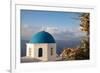 Blue domed Greek Orthodox church with bougainvillea flowers in Oia, Santorini, Greece.-Michele Niles-Framed Photographic Print