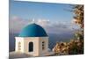 Blue domed Greek Orthodox church with bougainvillea flowers in Oia, Santorini, Greece.-Michele Niles-Mounted Photographic Print