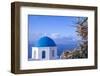 Blue domed Greek Orthodox church with bougainvillea flowers in Oia, Santorini, Greece.-Michele Niles-Framed Photographic Print