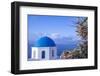 Blue domed Greek Orthodox church with bougainvillea flowers in Oia, Santorini, Greece.-Michele Niles-Framed Photographic Print