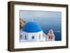 Blue domed white church overlooking boat in Aegean Sea, Santorini, Cyclades-Ed Hasler-Framed Photographic Print