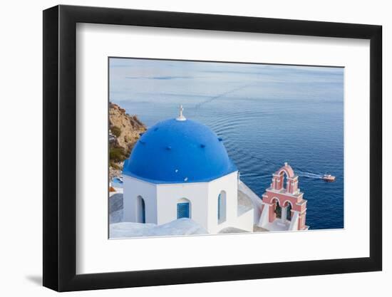 Blue domed white church overlooking boat in Aegean Sea, Santorini, Cyclades-Ed Hasler-Framed Photographic Print