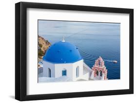 Blue domed white church overlooking boat in Aegean Sea, Santorini, Cyclades-Ed Hasler-Framed Photographic Print