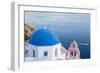 Blue domed white church overlooking boat in Aegean Sea, Santorini, Cyclades-Ed Hasler-Framed Photographic Print