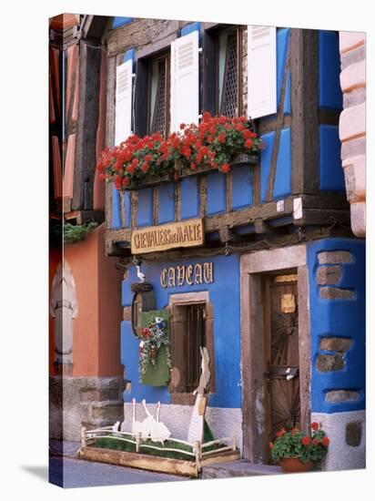 Blue House with Windowbox Full of Geraniums, Niedermorschwihr, Haut-Rhin, Alsace, France-Ruth Tomlinson-Stretched Canvas