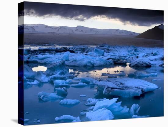 Blue Icebergs Floating on the Jokulsarlon Glacial Lagoon at Sunset, South Iceland, Iceland-Lee Frost-Stretched Canvas