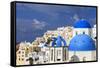 Blue Roofed Churches, Cities Embrace the Steep Mountain Sides, Santorini, Greece-Tom Norring-Framed Stretched Canvas