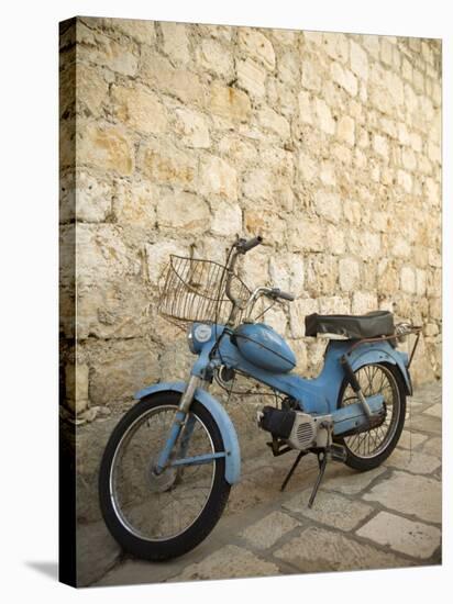 Blue scooter bike by old stone wall, Hvar Town, Hvar Island, Dalmatia, Croatia-Merrill Images-Stretched Canvas