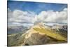 Blue sky and clouds on the rocky peaks of the Odle mountain range seen from Seceda, Val Gardena, Tr-Roberto Moiola-Stretched Canvas