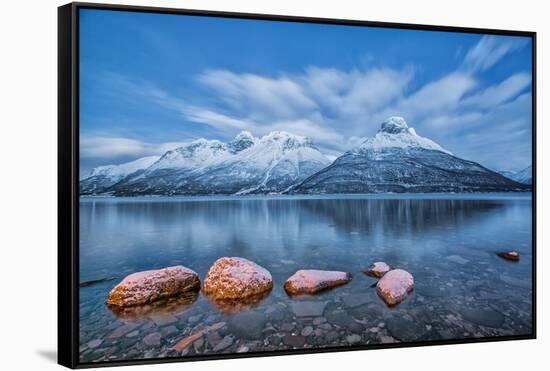 Blue sky at dusk and snowy peaks are reflected in the frozen sea at Oteren Storfjorden Lapland Lyng-ClickAlps-Framed Stretched Canvas
