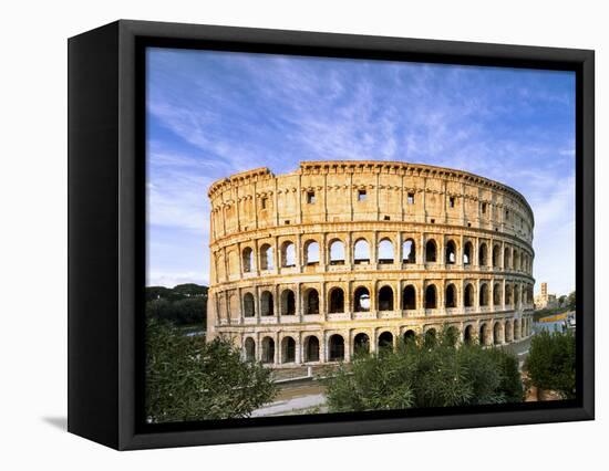 Blue sky at sunrise frames the ancient Colosseum (Flavian Amphitheatre), UNESCO World Heritage Site-Roberto Moiola-Framed Stretched Canvas