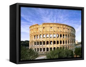 Blue sky at sunrise frames the ancient Colosseum (Flavian Amphitheatre), UNESCO World Heritage Site-Roberto Moiola-Framed Stretched Canvas