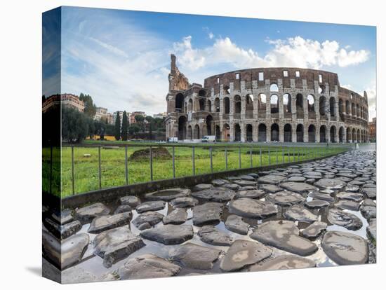 Blue sky at sunrise frames the ancient Colosseum (Flavian Amphitheatre), UNESCO World Heritage Site-Roberto Moiola-Stretched Canvas