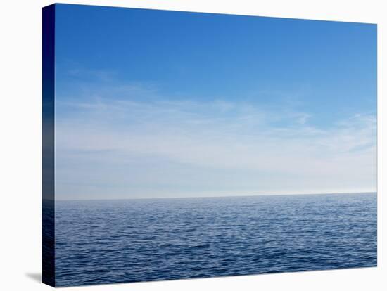 Blue Sky over Calm Sea-Norbert Schaefer-Stretched Canvas