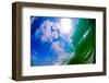 Blue Sky-puffy white clouds, blue sky, and sun in the sky seen through the curtain of a wave-Mark A Johnson-Framed Photographic Print